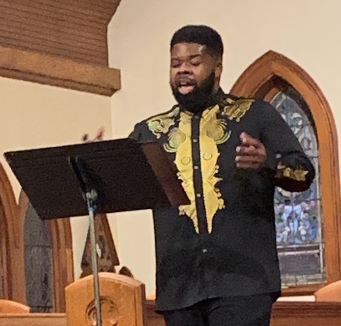 Tenor Corey Galloway singing during a Kaleidoscope Concert, February, 2026.